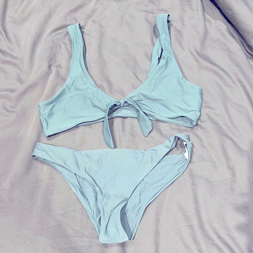 Selling 8 Bikini pairs with couple extra tops and bottoms.